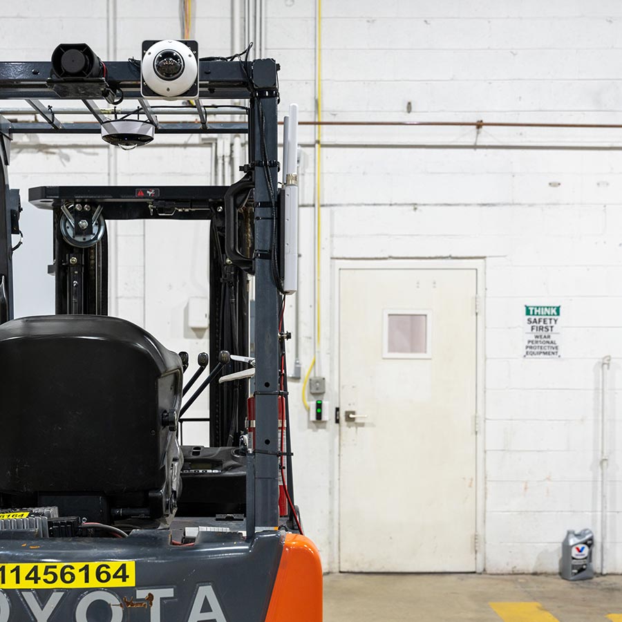 Security cameras mounted on the roll cage of a forklift